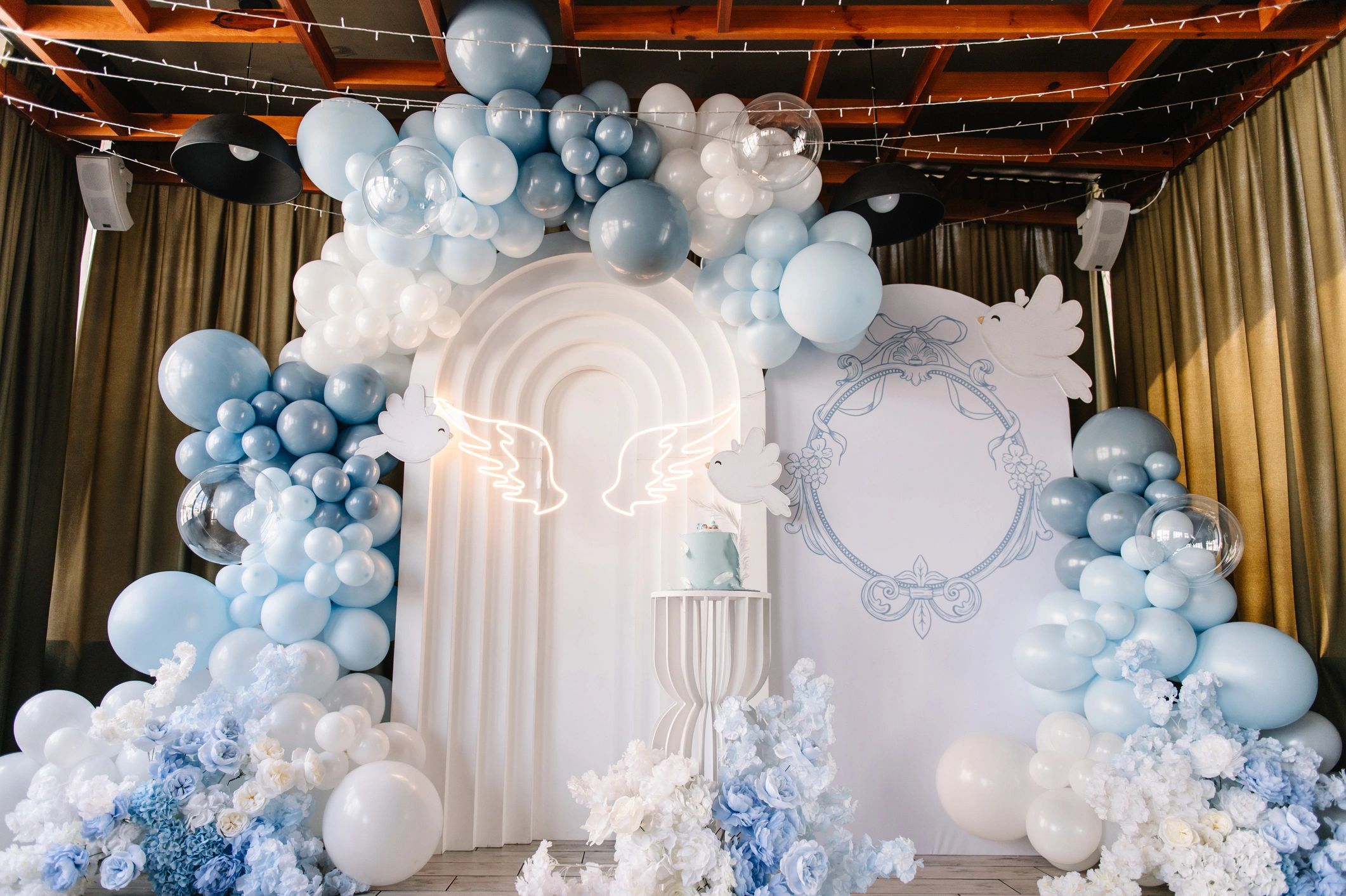Elegant party setup with balloon arch and styled celebration display